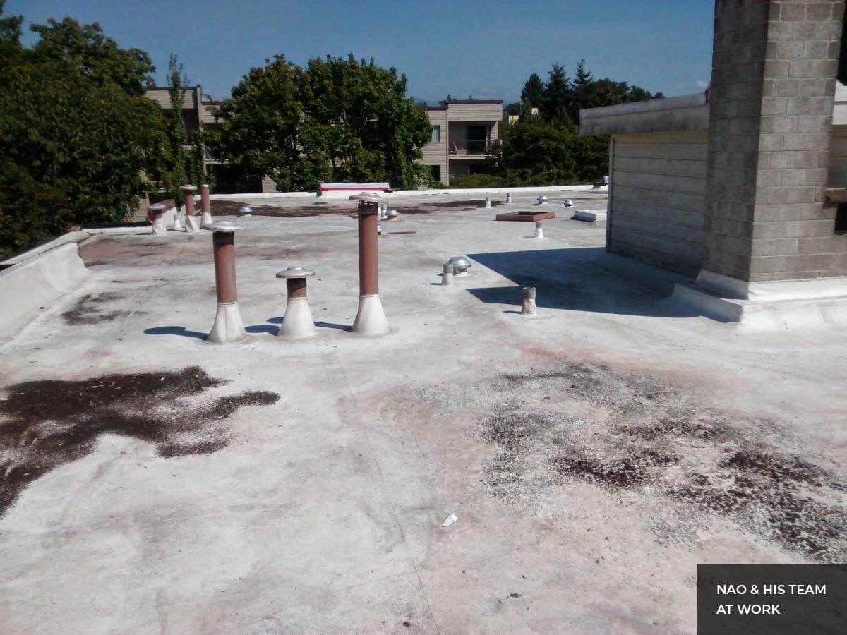 Flat roof repair around vents and curbs