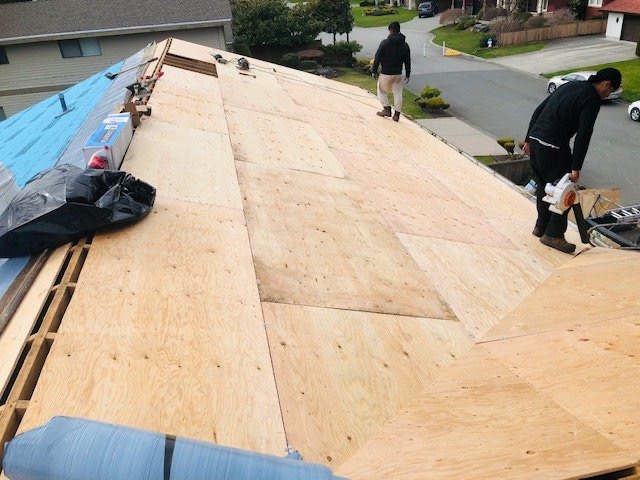 New plywood sheathing going down on a re-deck